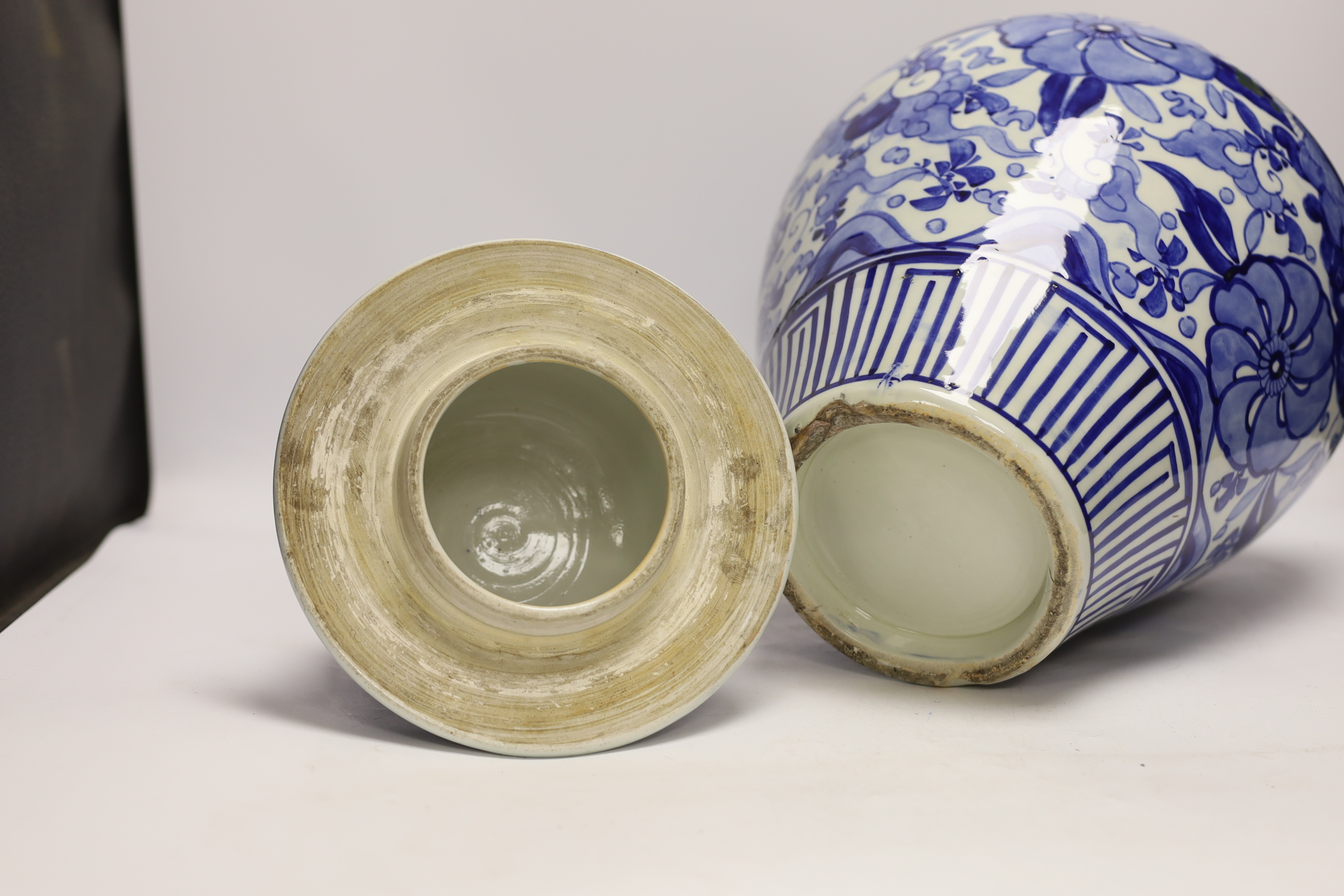 A large Japanese Arita blue and white jar and cover, 54cm